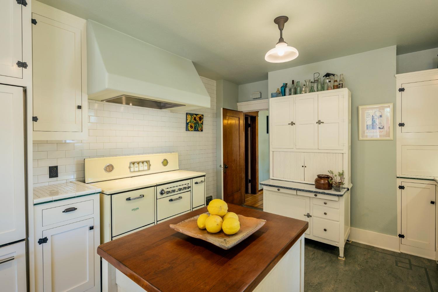46 Pollasky Avenue Clovis, CA 93612 - Photo 19 of 69 a kitchen with a sink a stove and refrigerator