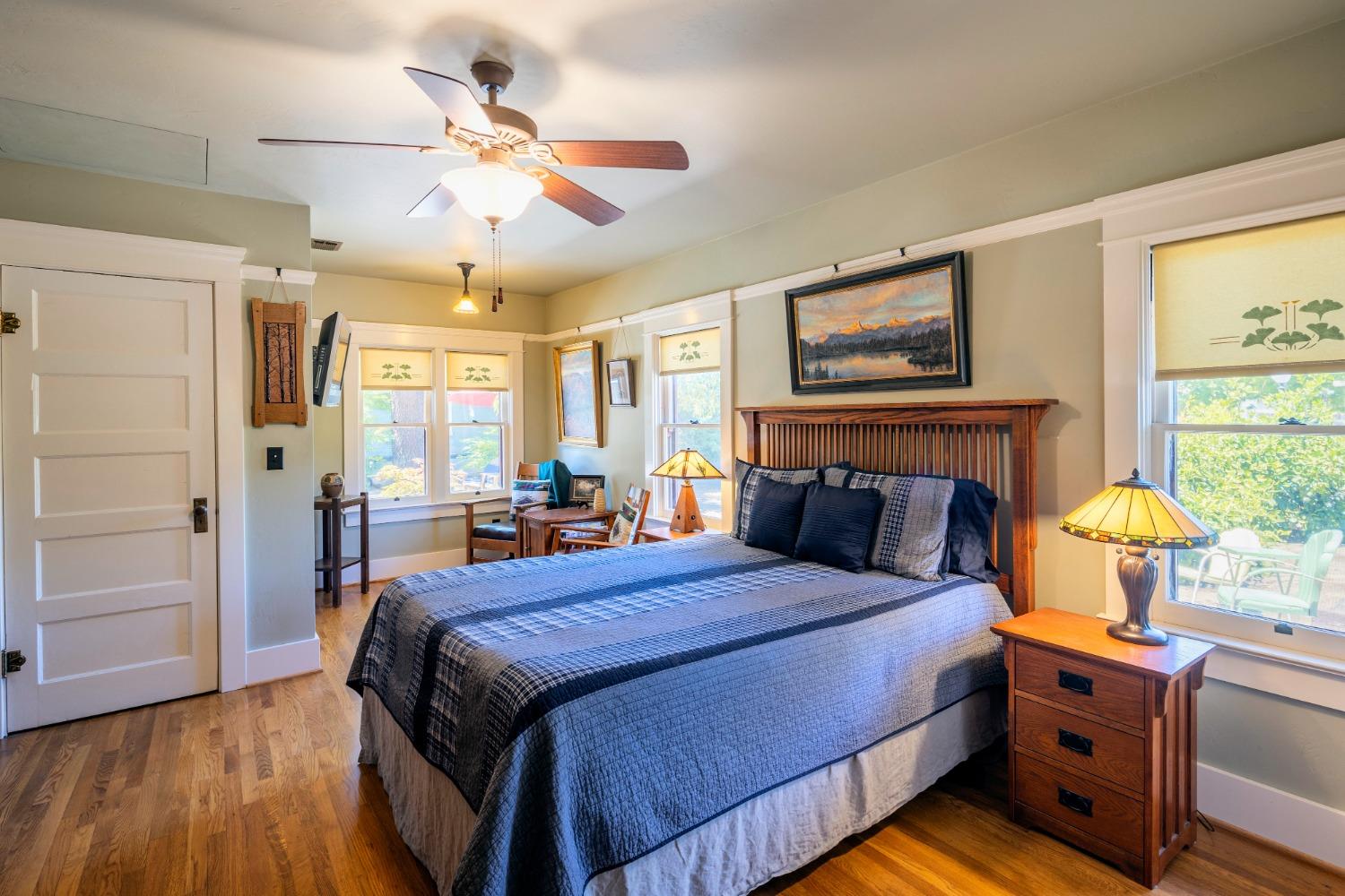 46 Pollasky Avenue Clovis, CA 93612 - Photo 24 of 69 a bedroom with a bed and wooden floor