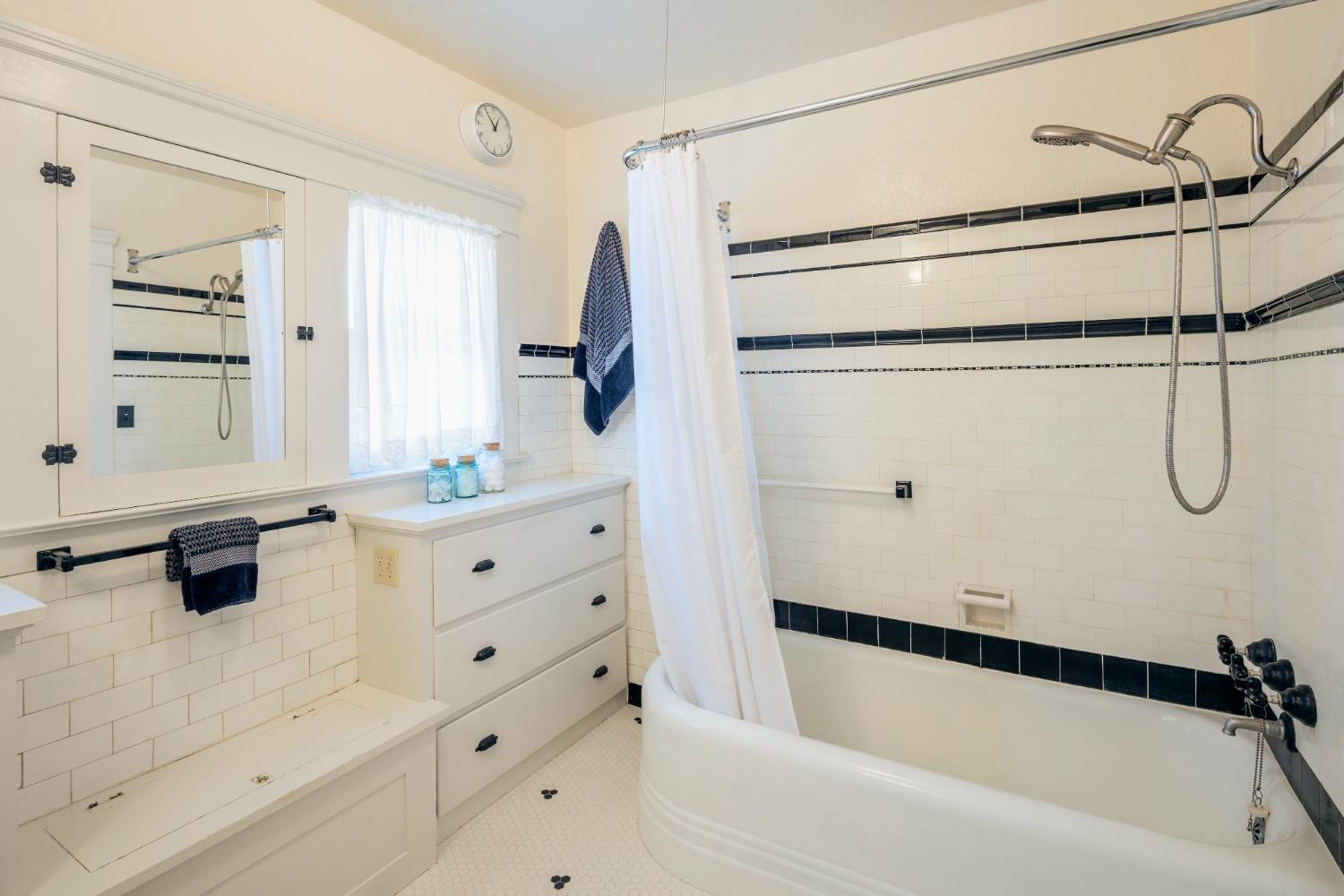 46 Pollasky Avenue Clovis, CA 93612 - Photo 28 of 69 a bathroom with a tub sink a mirror and shower