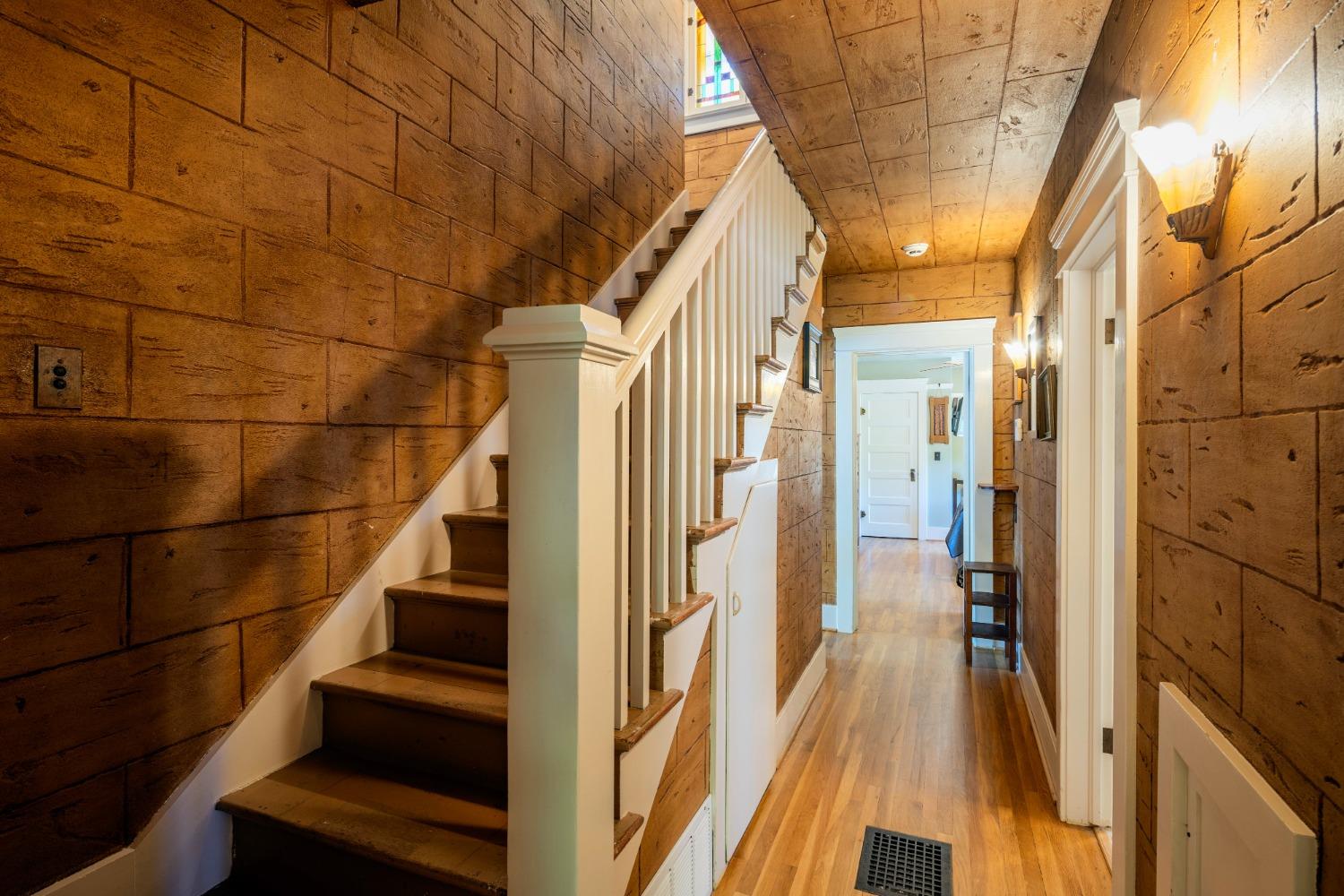 46 Pollasky Avenue Clovis, CA 93612 - Photo 29 of 69 a view of staircase with lots of frames on wall and a large window