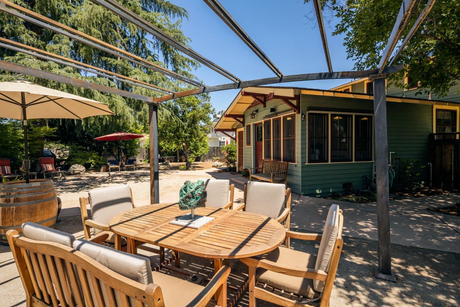 46 Pollasky Avenue Clovis, CA 93612 - Photo 37 of 69 a view of a patio with a table and chairs under an umbrella