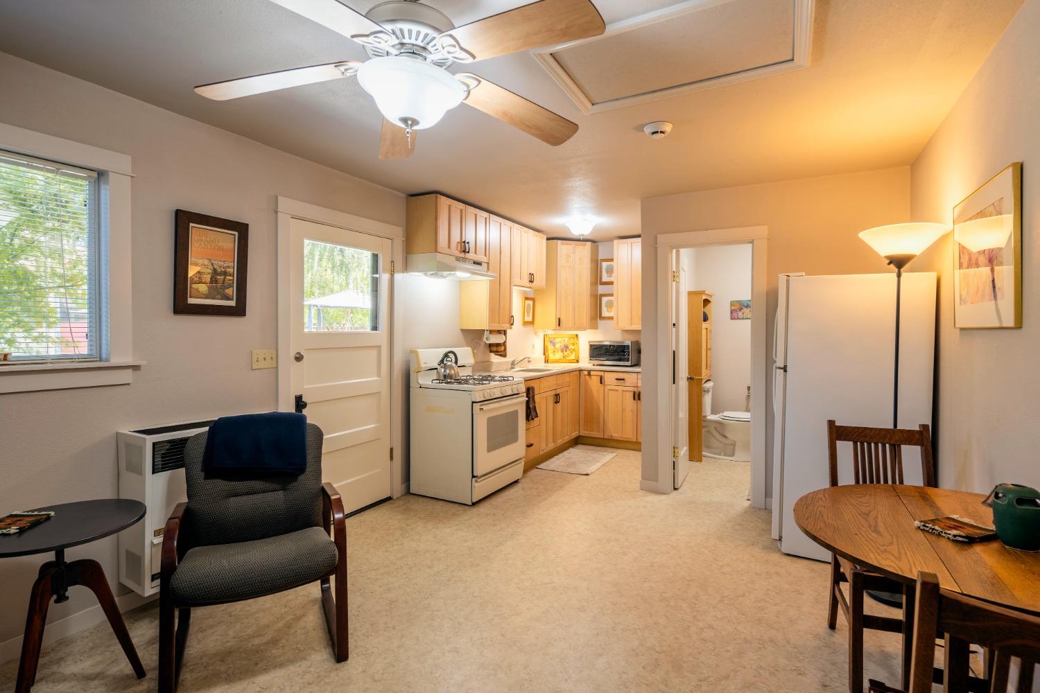 46 Pollasky Avenue Clovis, CA 93612 - Photo 50 of 69 a living room with furniture and a dining table