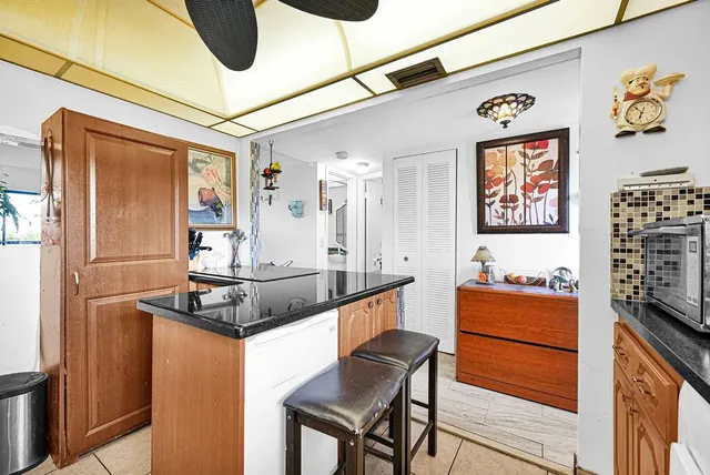 a kitchen with stainless steel appliances granite countertop a stove and a refrigerator