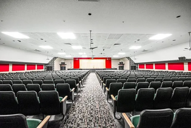 a living room with lots of furniture and a wooden floor