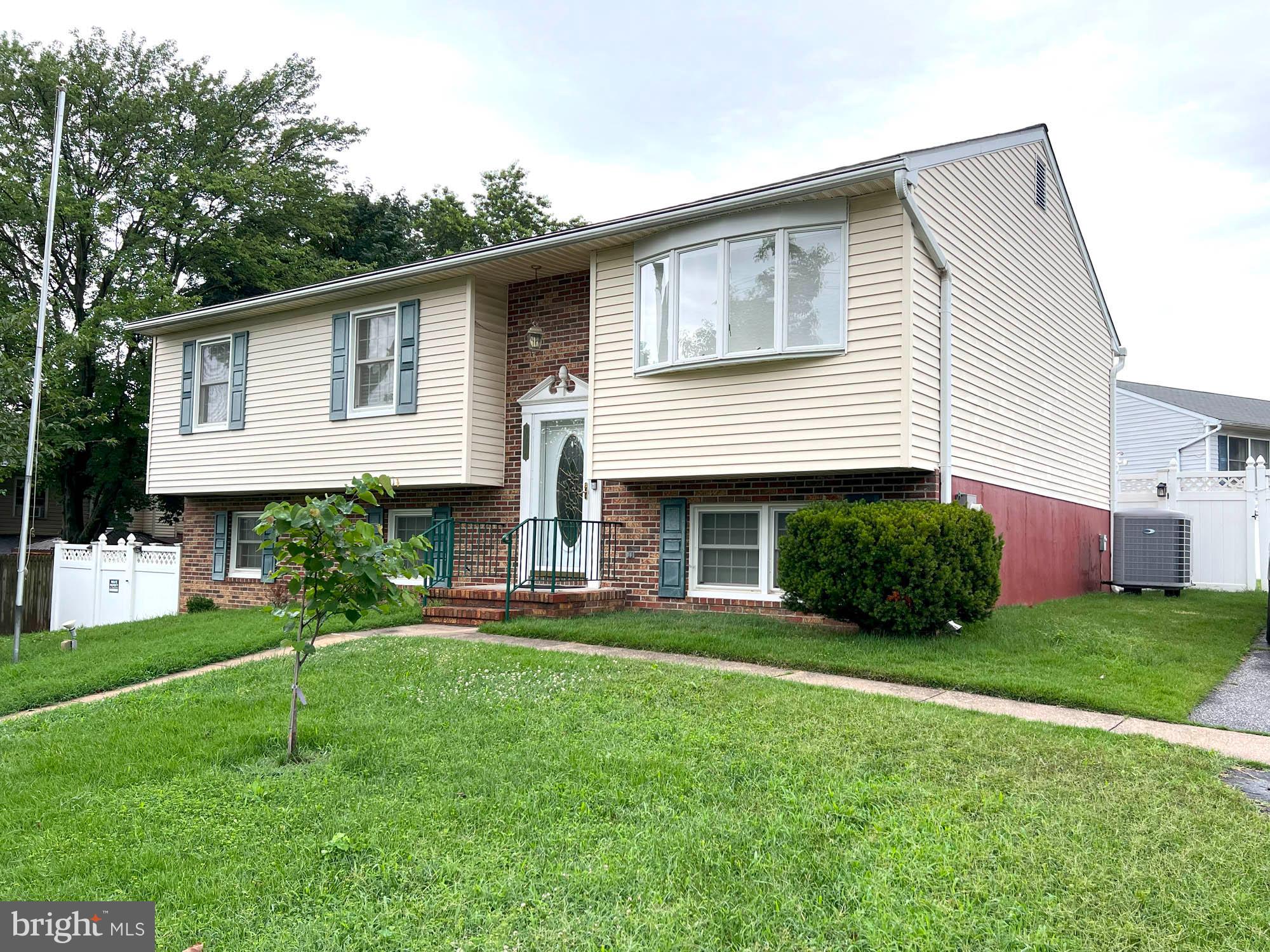 7024 Sollers Point Road Baltimore, MD 21222 - Photo 16 of 22 a front view of house with a garden