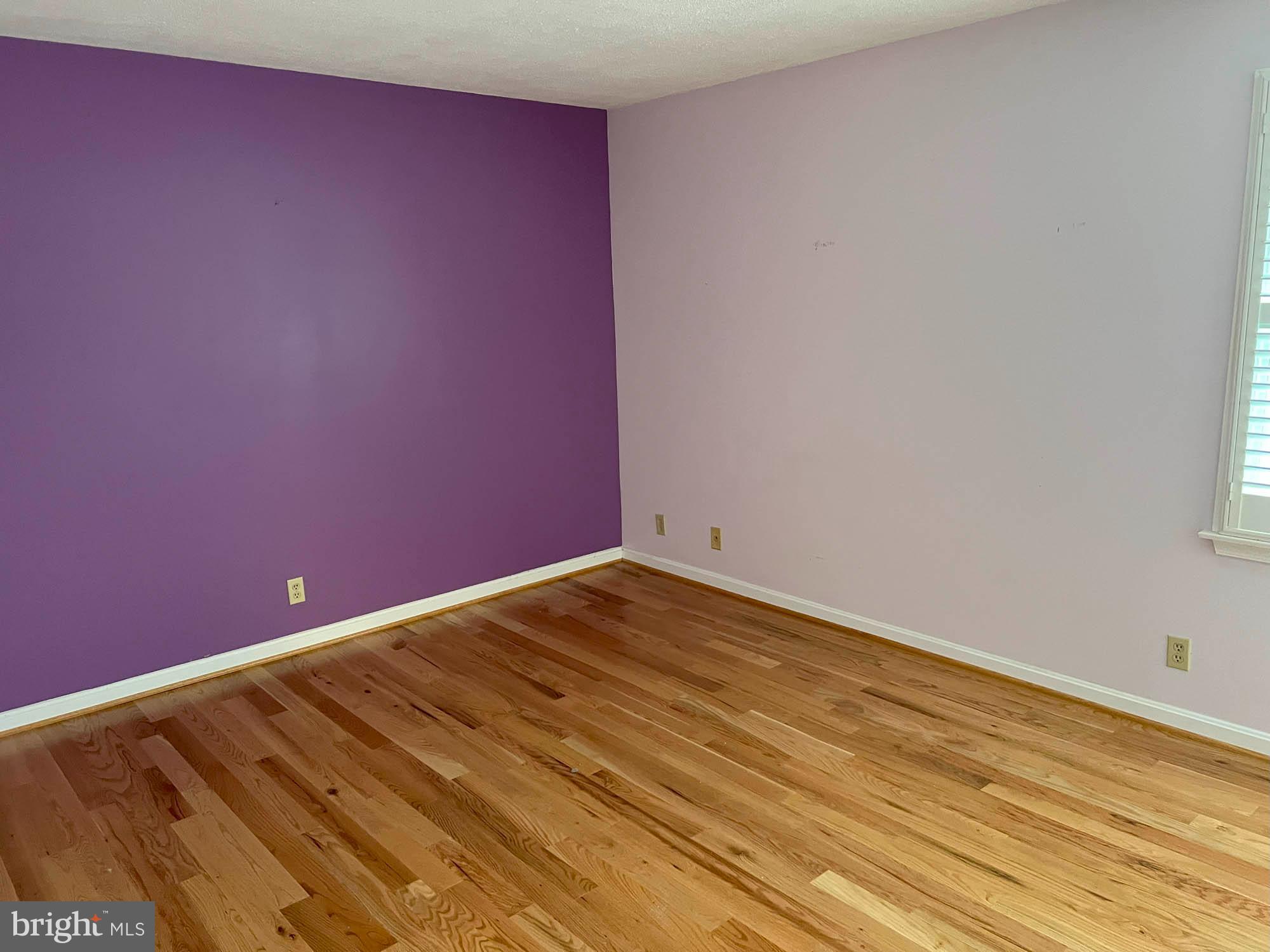 7024 Sollers Point Road Baltimore, MD 21222 - Photo 8 of 22 a view of empty room with wooden floor