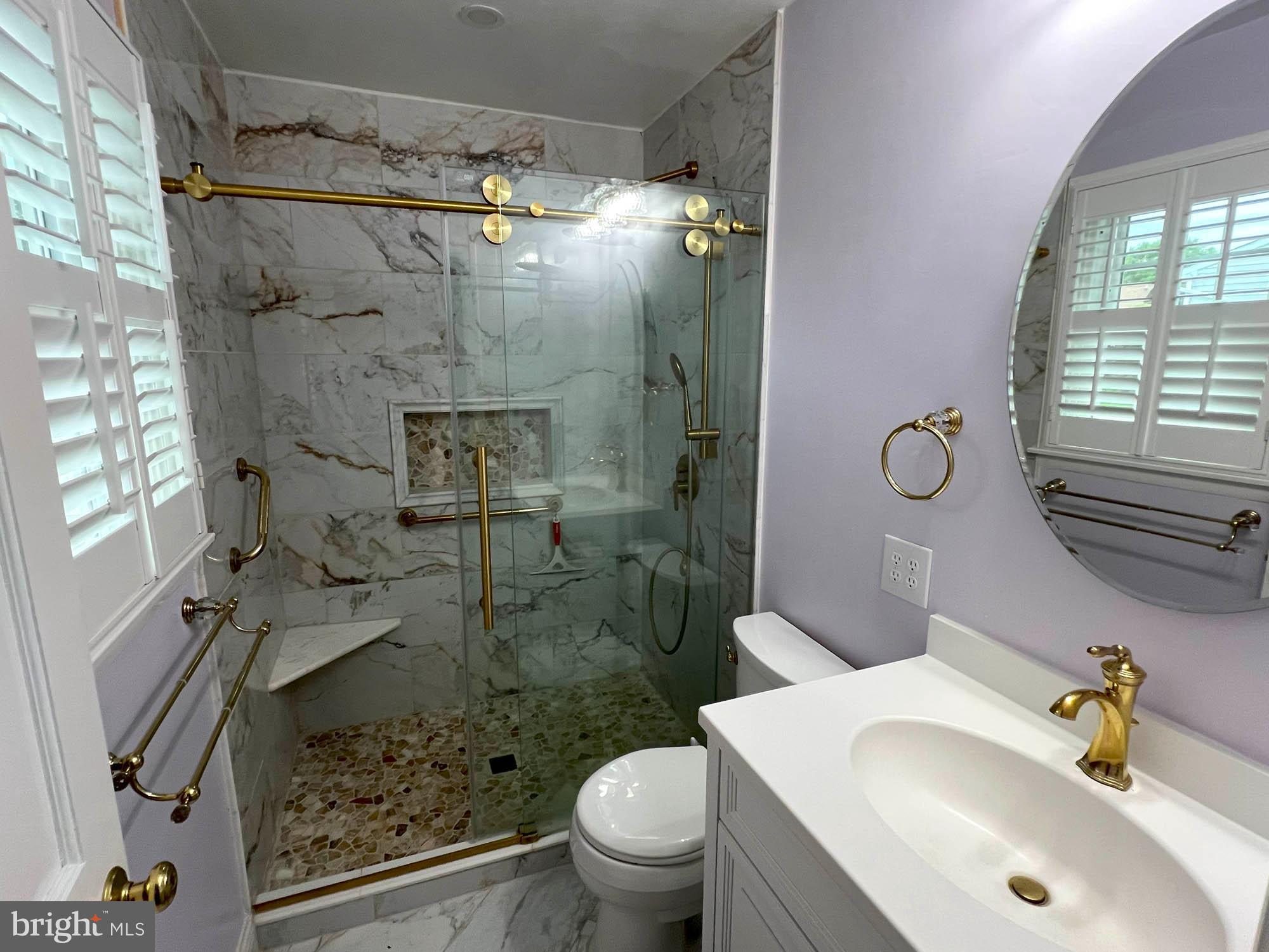 7024 Sollers Point Road Baltimore, MD 21222 - Photo 10 of 22 a bathroom with a sink toilet and shower