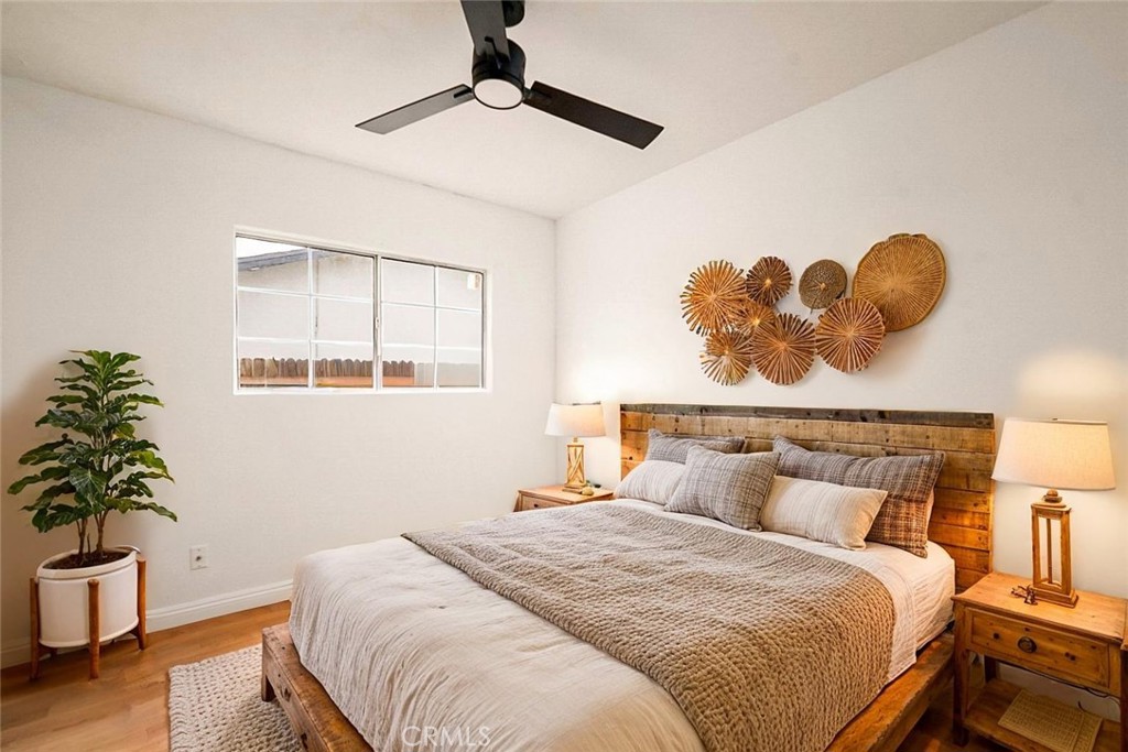 522 Price Street Bakersfield, CA 93307 - Photo 12 of 23 a bedroom with a bed and a potted plant