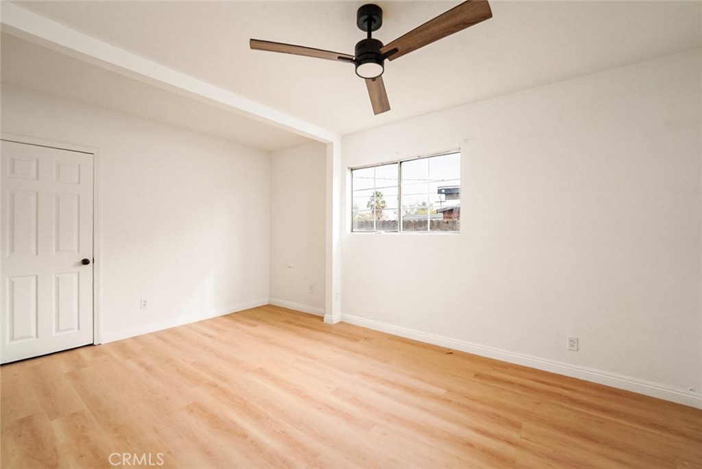 522 Price Street Bakersfield, CA 93307 - Photo 13 of 23 a view of empty room with wooden floor