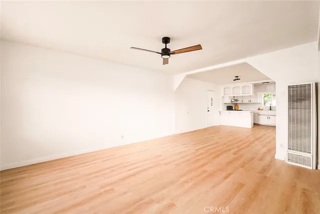 a view of a kitchen with wooden floor