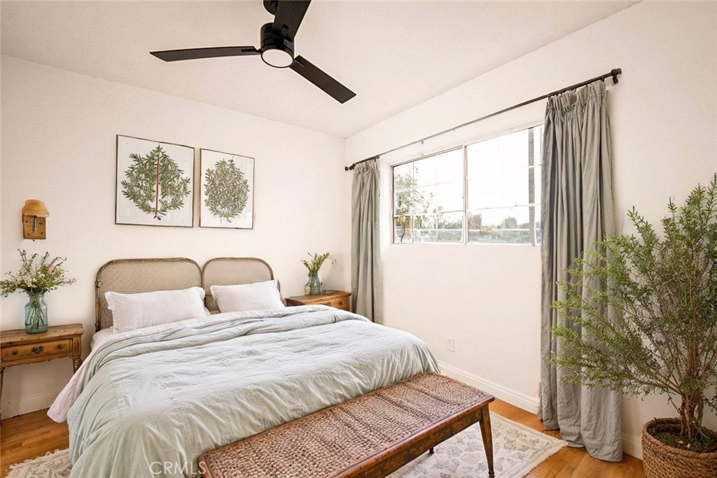 522 Price Street Bakersfield, CA 93307 - Photo 10 of 23 a bedroom with a bed and a window