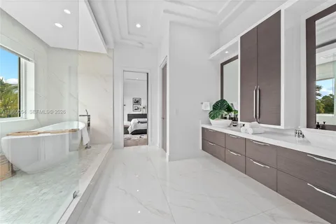 a large spacious bathroom with a large tub and sink