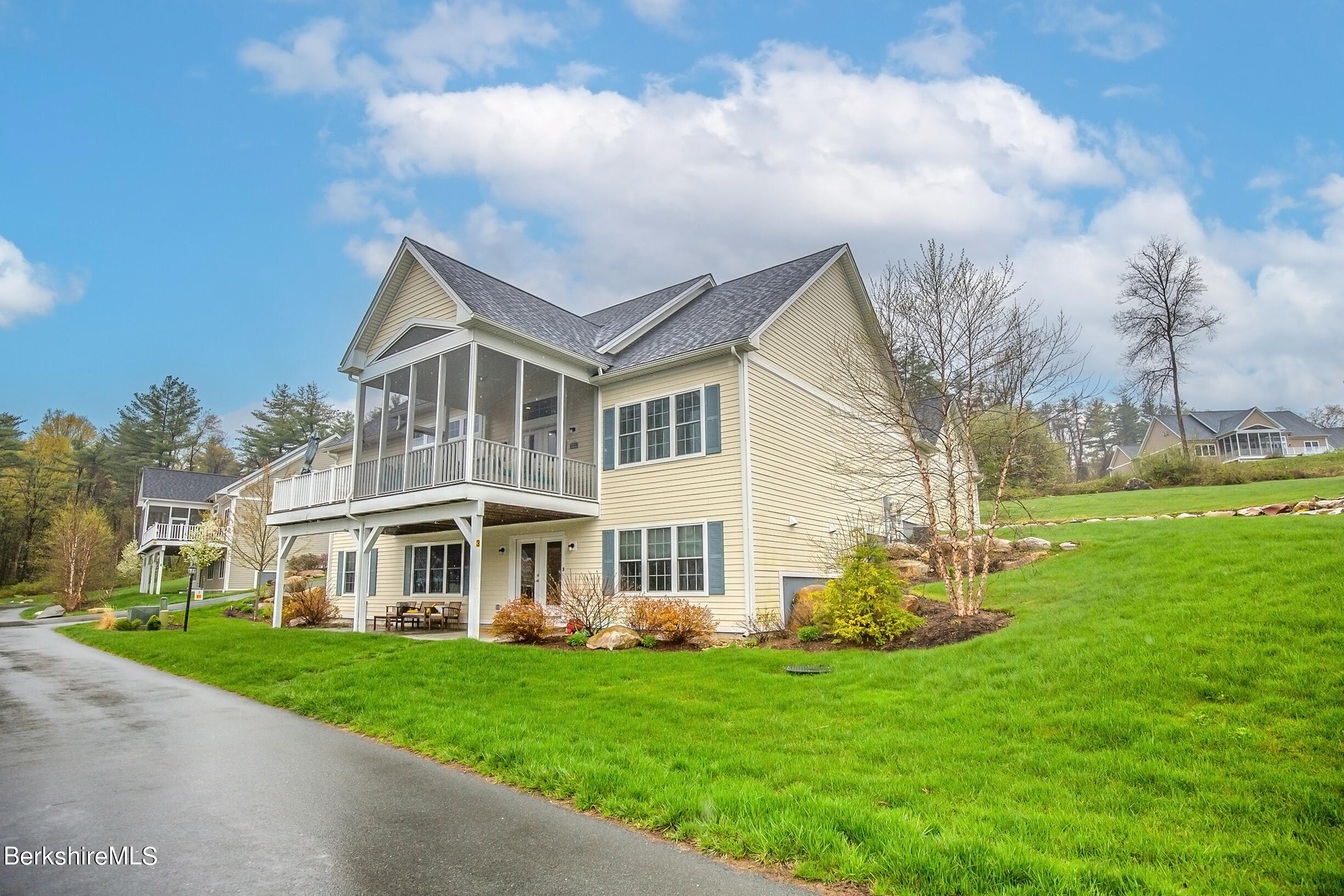 a front view of a house with a yard