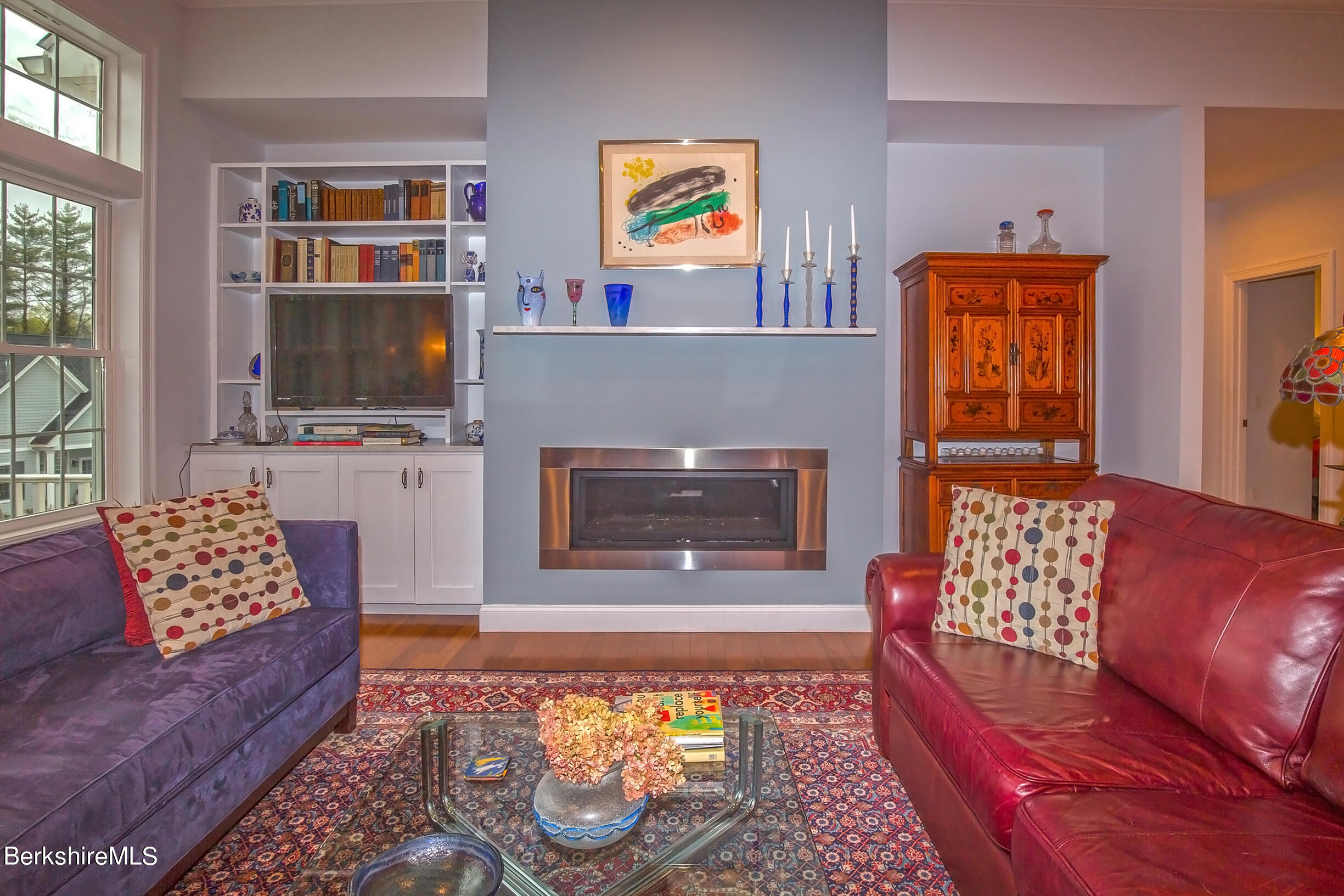 3 Burning Tree Road Great Barrington, MA 01230 - Photo 16 of 50 a living room with furniture fireplace and flat screen tv