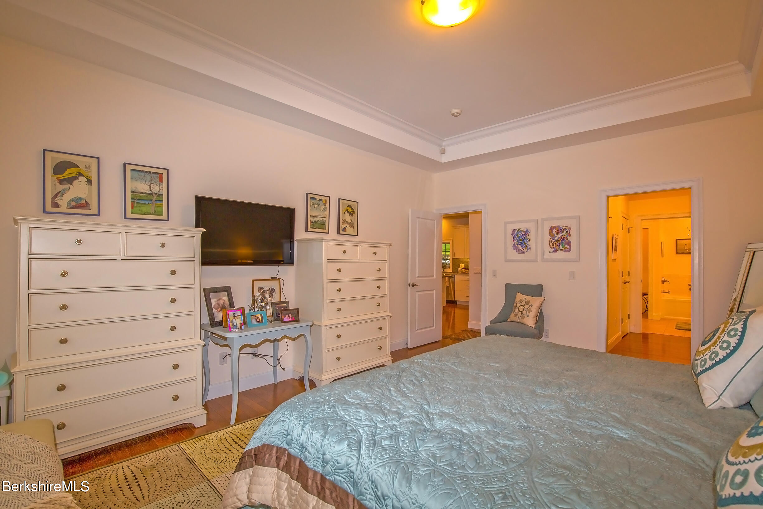 3 Burning Tree Road Great Barrington, MA 01230 - Photo 19 of 50 a bedroom with a bed and wooden floor