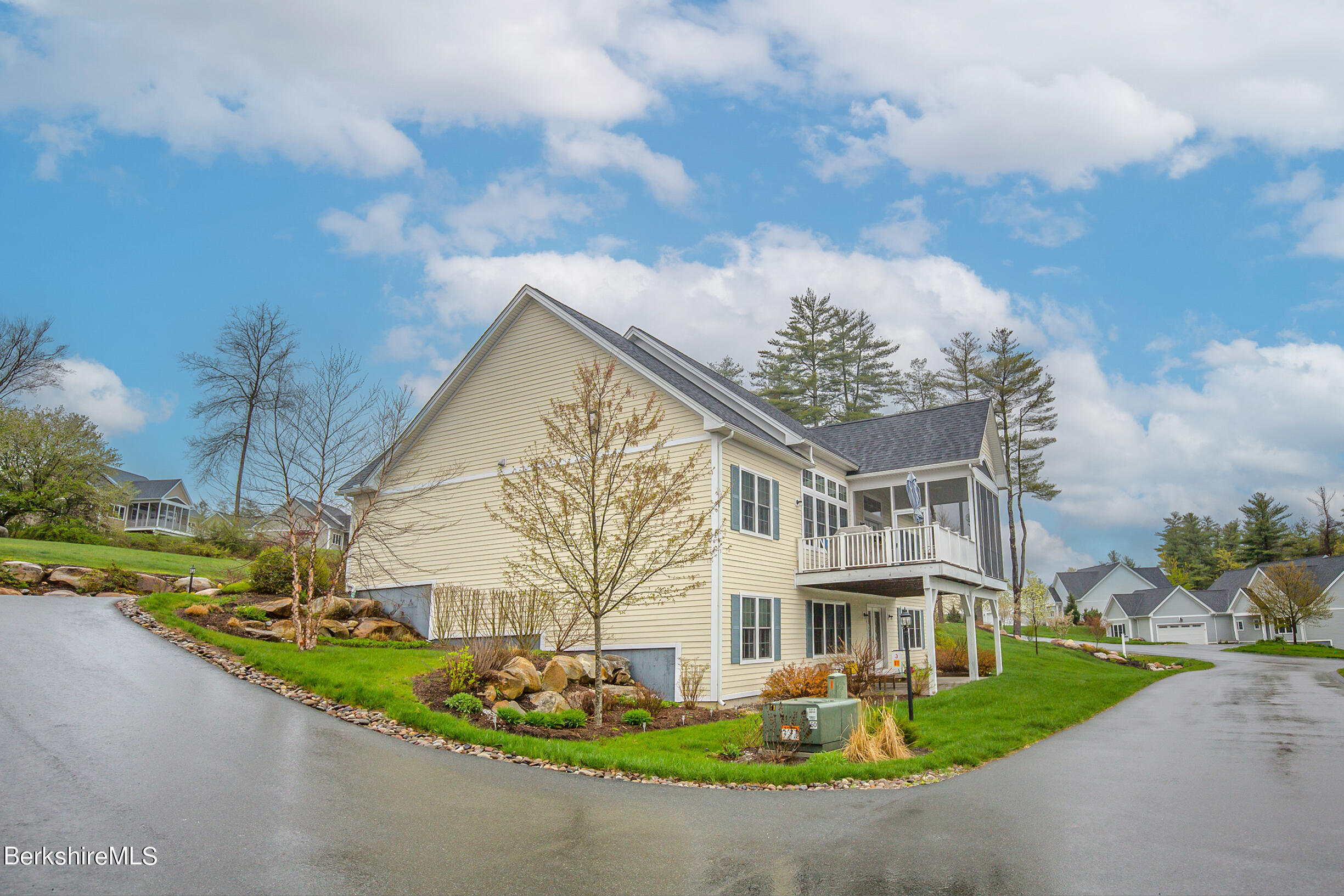 3 Burning Tree Road Great Barrington, MA 01230 - Photo 2 of 50 a front view of a house with a garden and trees