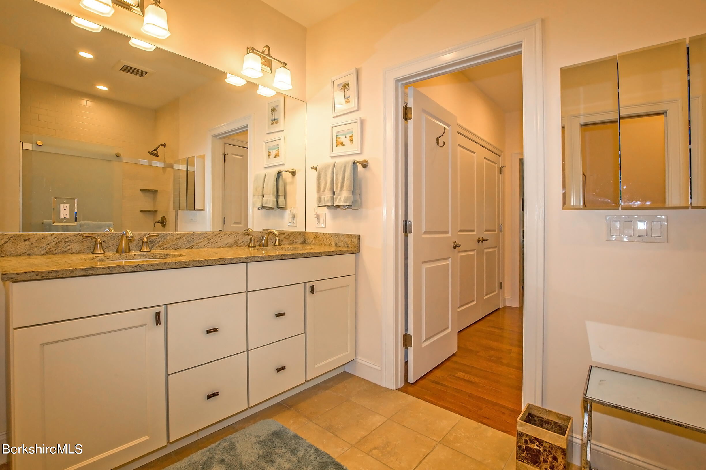 3 Burning Tree Road Great Barrington, MA 01230 - Photo 23 of 50 a bathroom with a double vanity sink and mirror