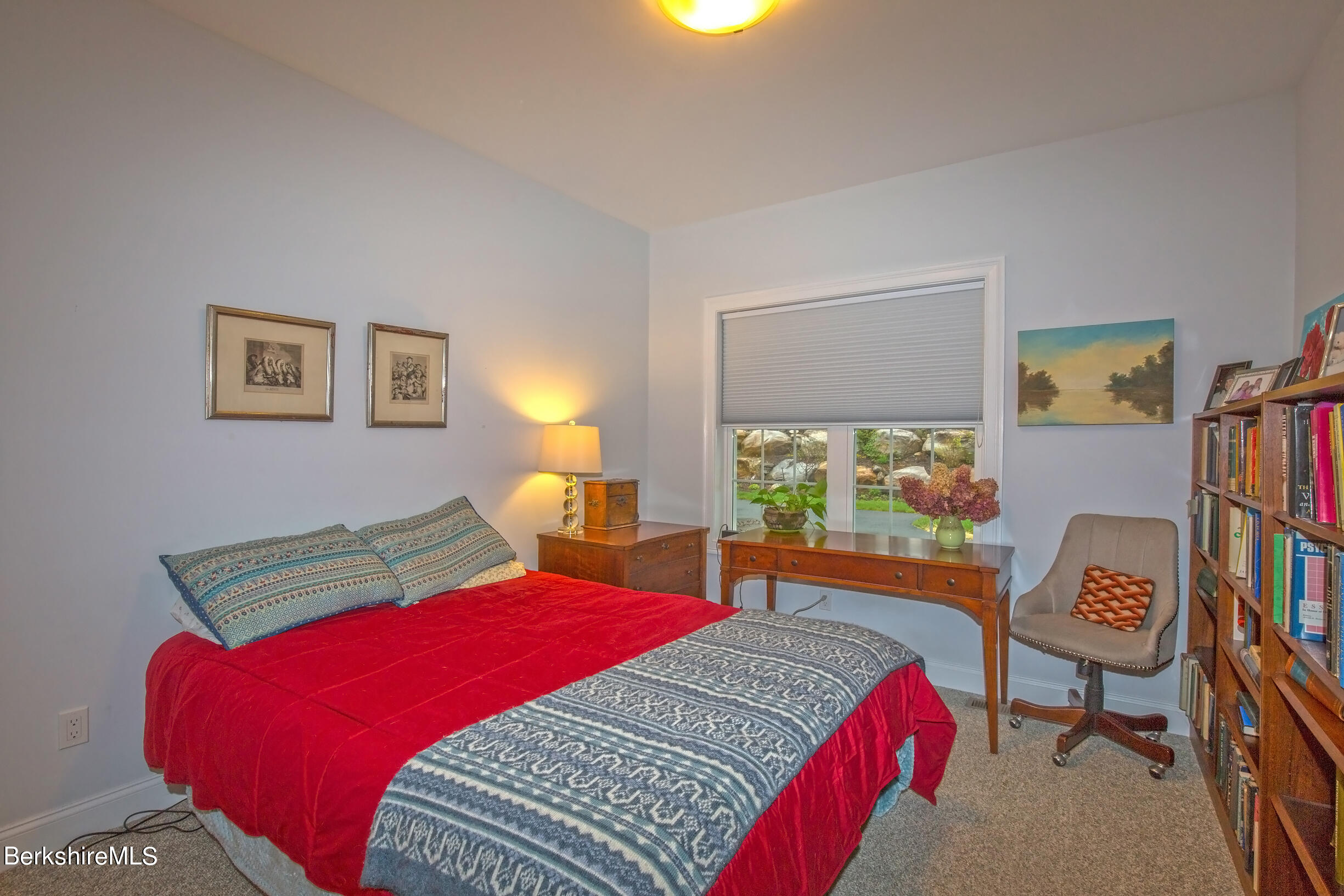 3 Burning Tree Road Great Barrington, MA 01230 - Photo 25 of 50 a bedroom with a bed and a dresser next to a window