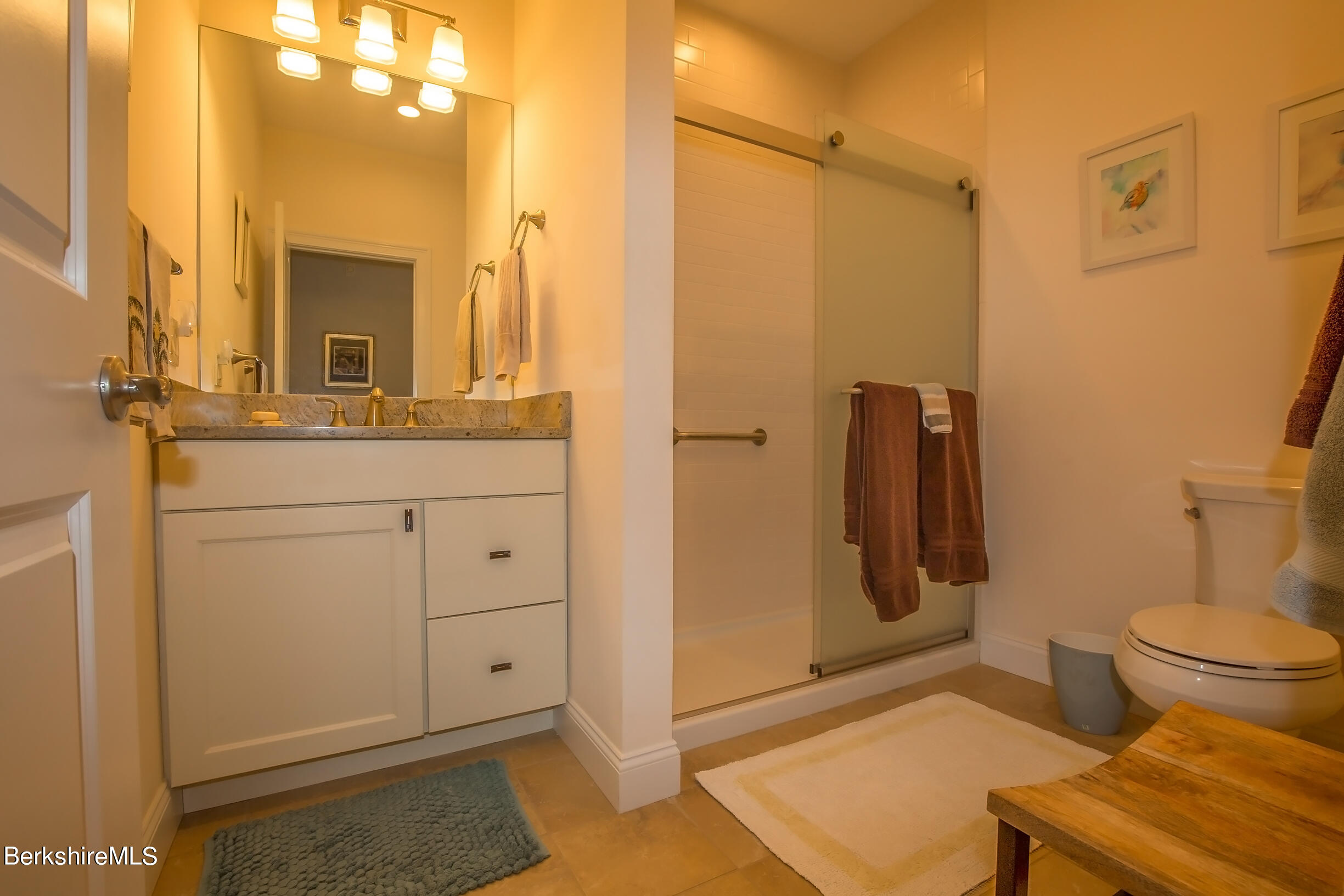 3 Burning Tree Road Great Barrington, MA 01230 - Photo 27 of 50 a bathroom with a granite countertop sink toilet and shower