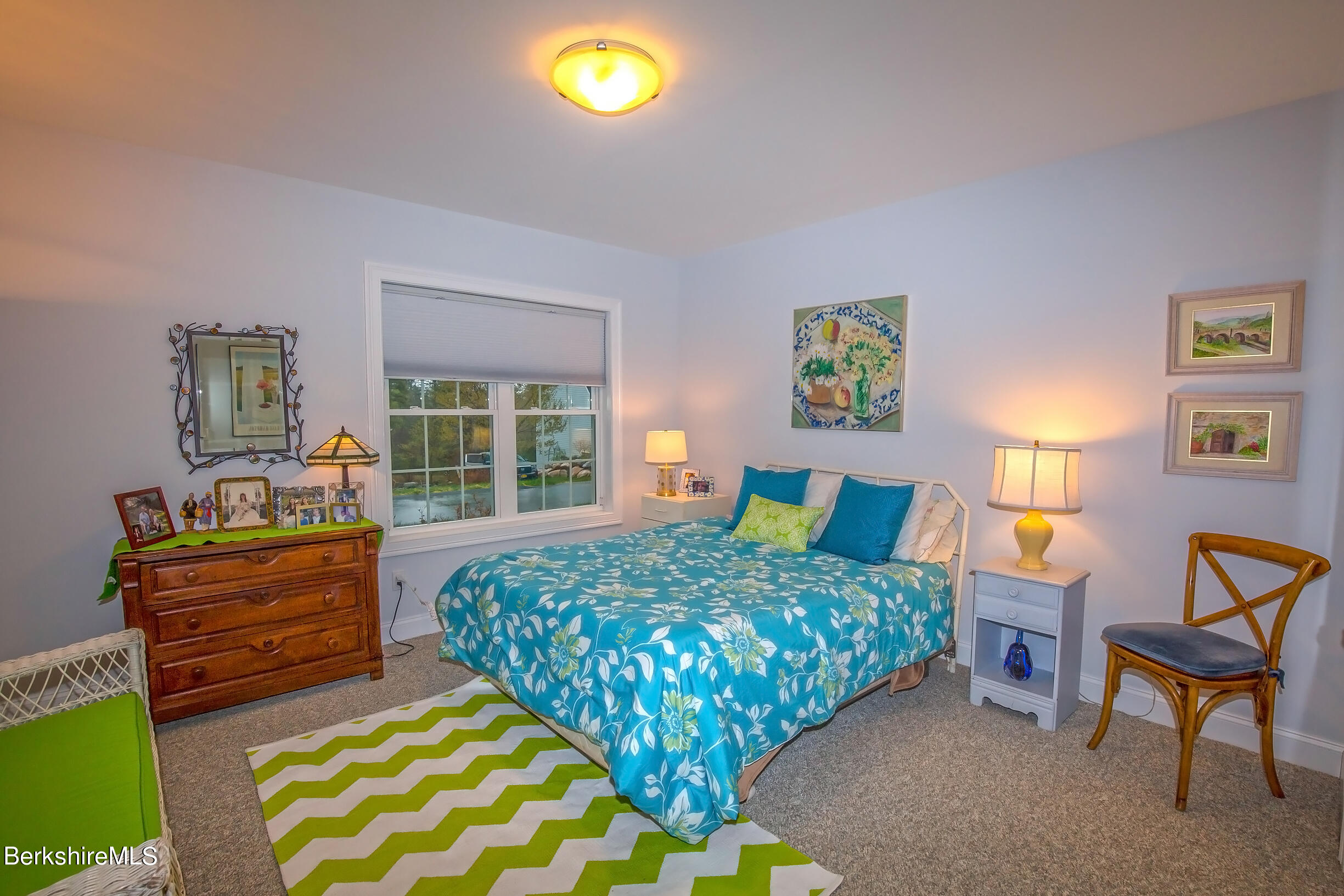 3 Burning Tree Road Great Barrington, MA 01230 - Photo 35 of 50 a bed room with a bed and a chair