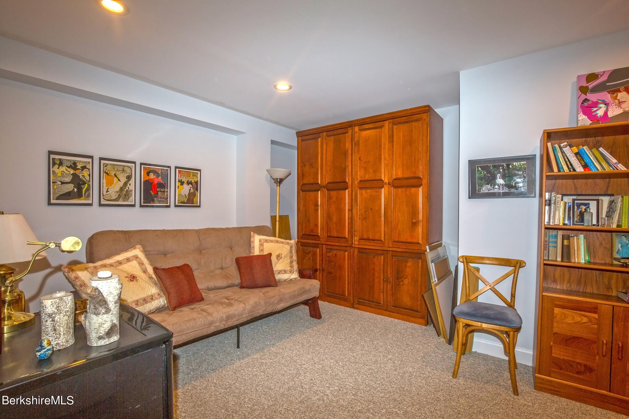 3 Burning Tree Road Great Barrington, MA 01230 - Photo 38 of 50 a living room with furniture a bookshelf and a window