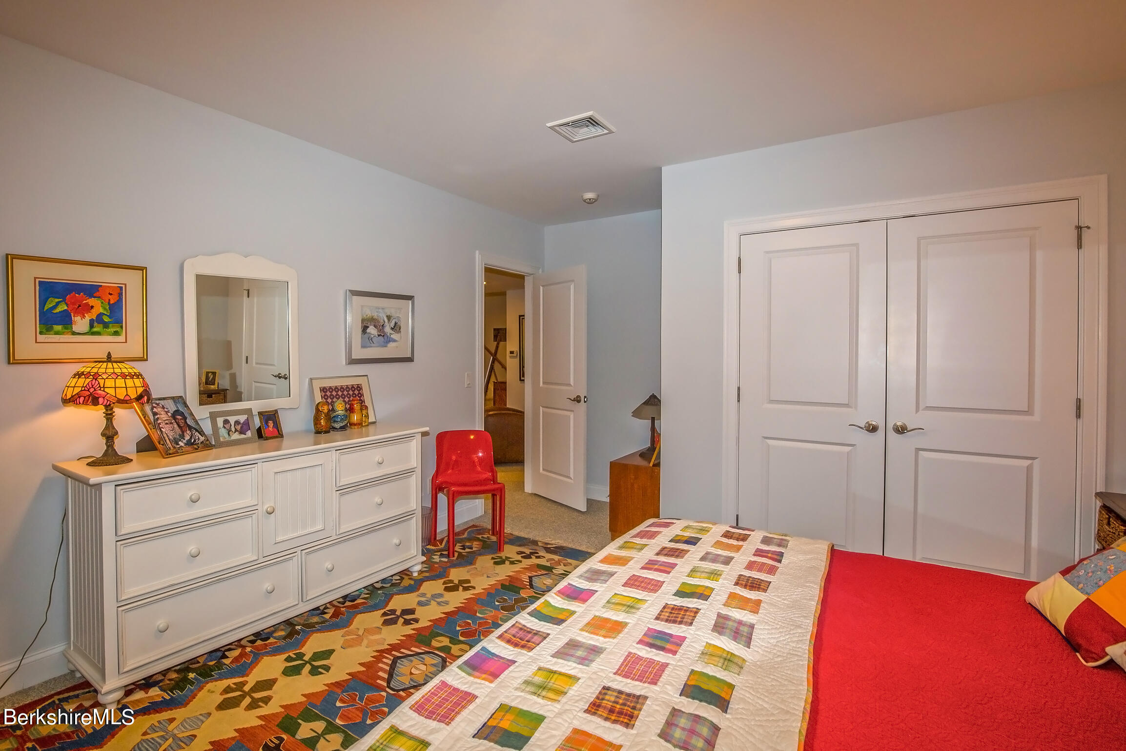 3 Burning Tree Road Great Barrington, MA 01230 - Photo 40 of 50 a bedroom with a bed and a dresser in it