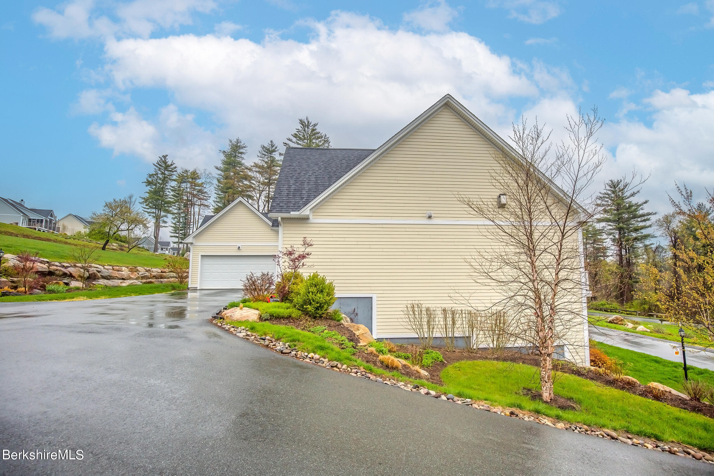 3 Burning Tree Road Great Barrington, MA 01230 - Photo 49 of 50 a view of a house with a small yard and a large tree