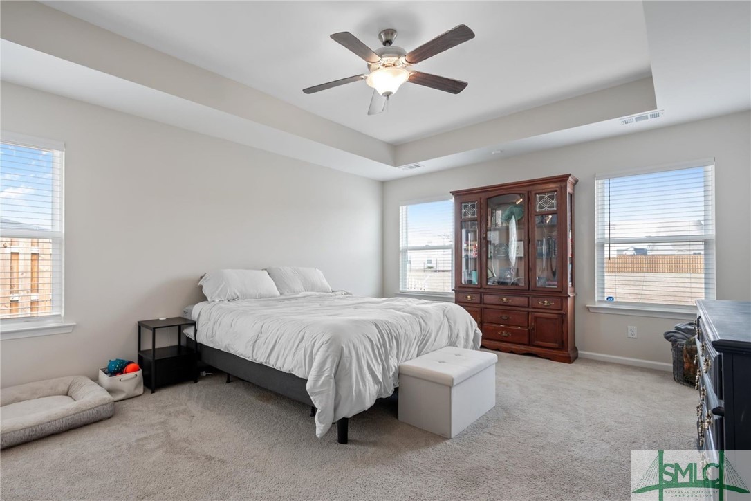138 Whitehaven Road Savannah, GA 31407 - Photo 14 of 37 Master suite with large windows and lagoon views.
