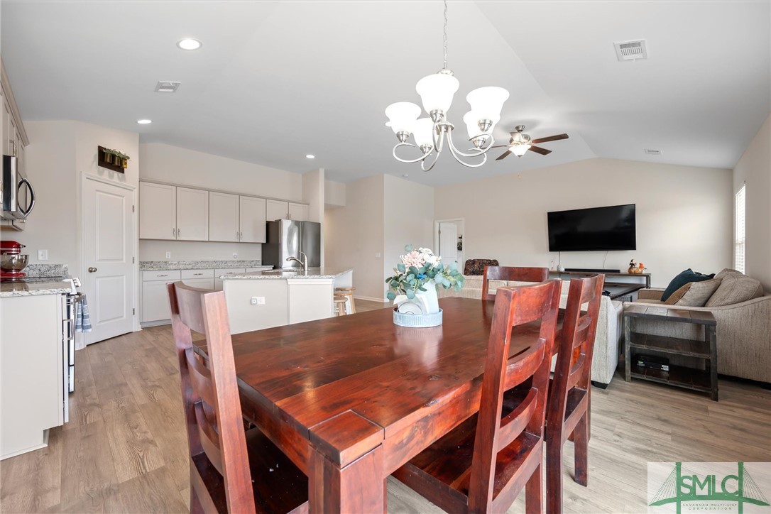 138 Whitehaven Road Savannah, GA 31407 - Photo 8 of 37 Dining opens to both great room and kitchen.