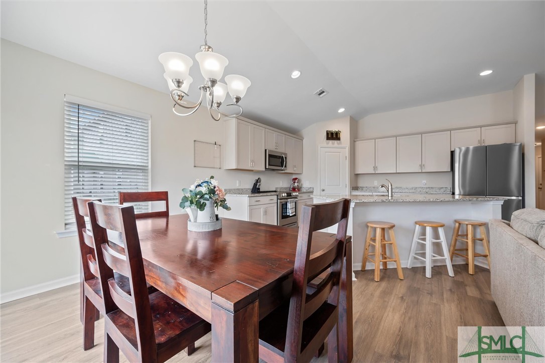138 Whitehaven Road Savannah, GA 31407 - Photo 9 of 37 Dining area is illuminated by chandelier lighting.