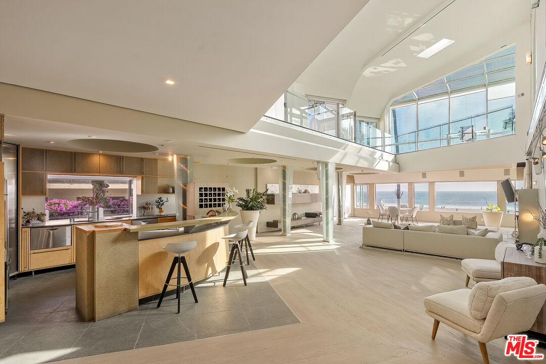 3111 Ocean Front Walk Marina del Rey, CA 90292 - Photo 5 of 17 a room with stainless steel appliances lots of wooden furniture