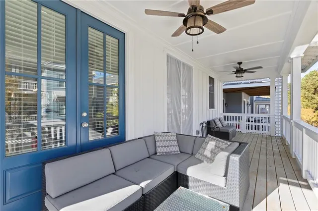 a living room with furniture and windows