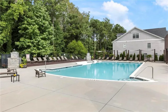 a view of swimming pool with chairs