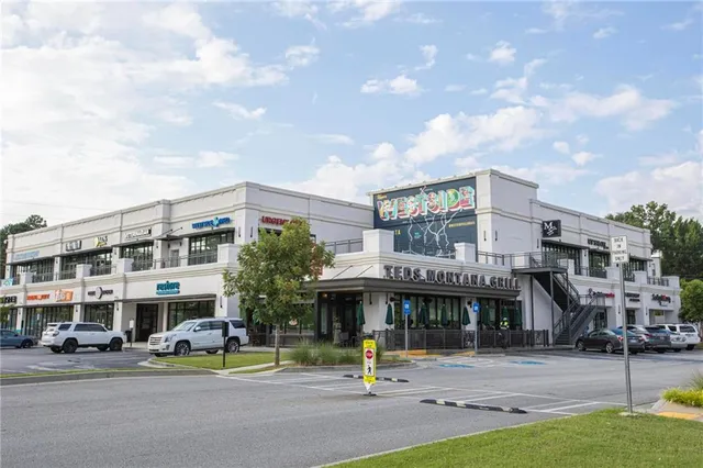 a view of a building with sitting area