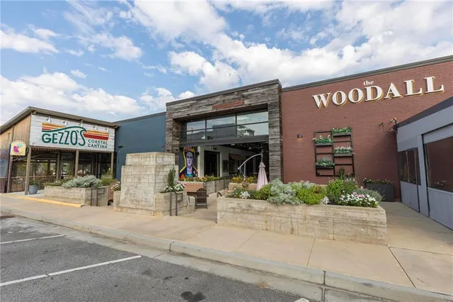 a front view of a building with garden