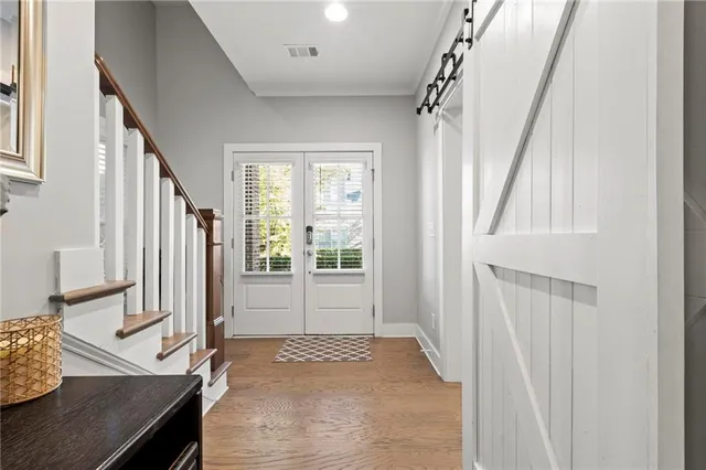 a view of a livingroom with furniture and stairs