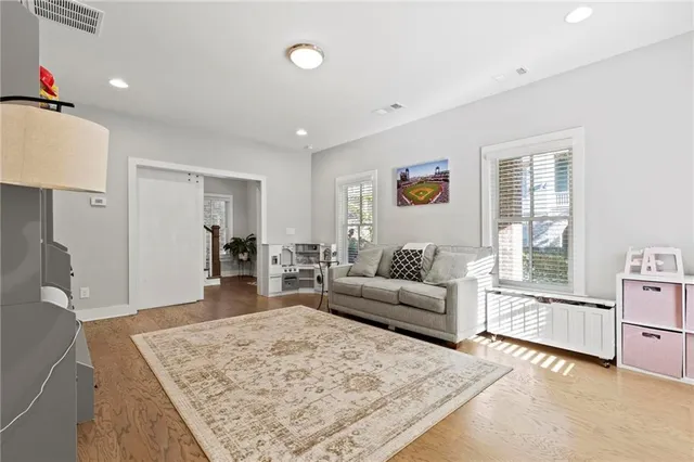 a living room with furniture and a rug