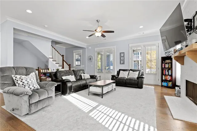 a living room with furniture or couch and a chandelier