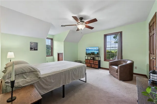 a spacious bathroom with a double vanity sink and a mirror