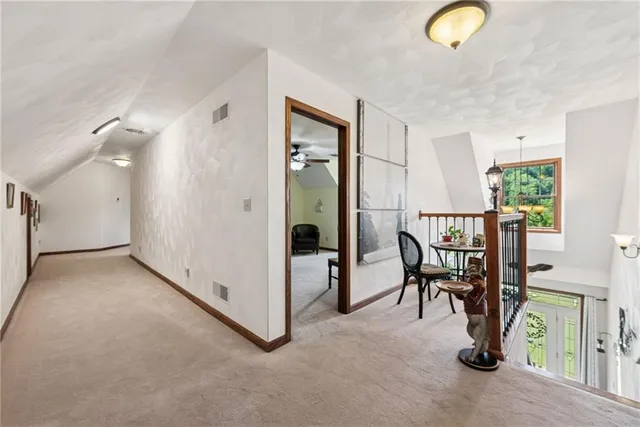 a view of a hallway with workspace and entryway