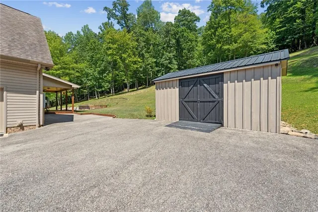 a front view of a house with a yard table and chairs