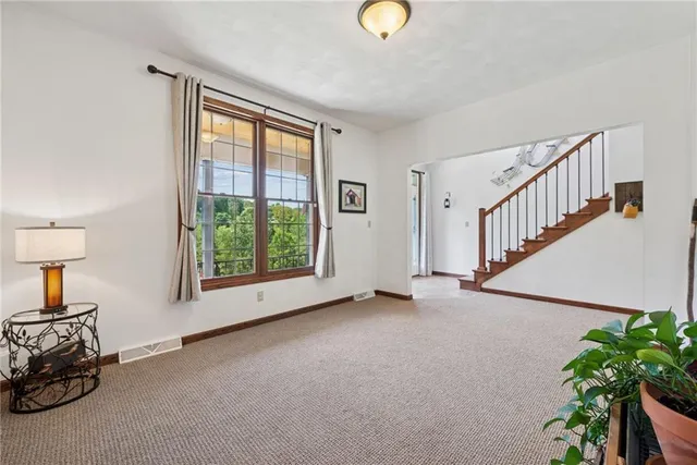 a view of livingroom with furniture and stairs