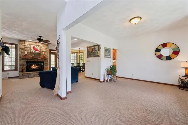 a view of livingroom with furniture and a fireplace