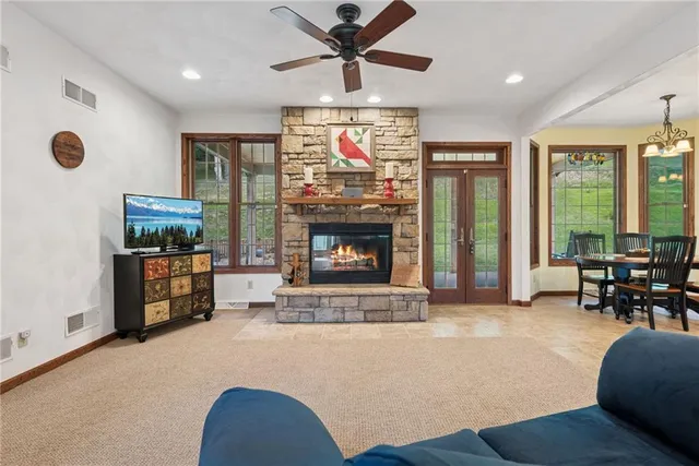 a living room with furniture and a fireplace