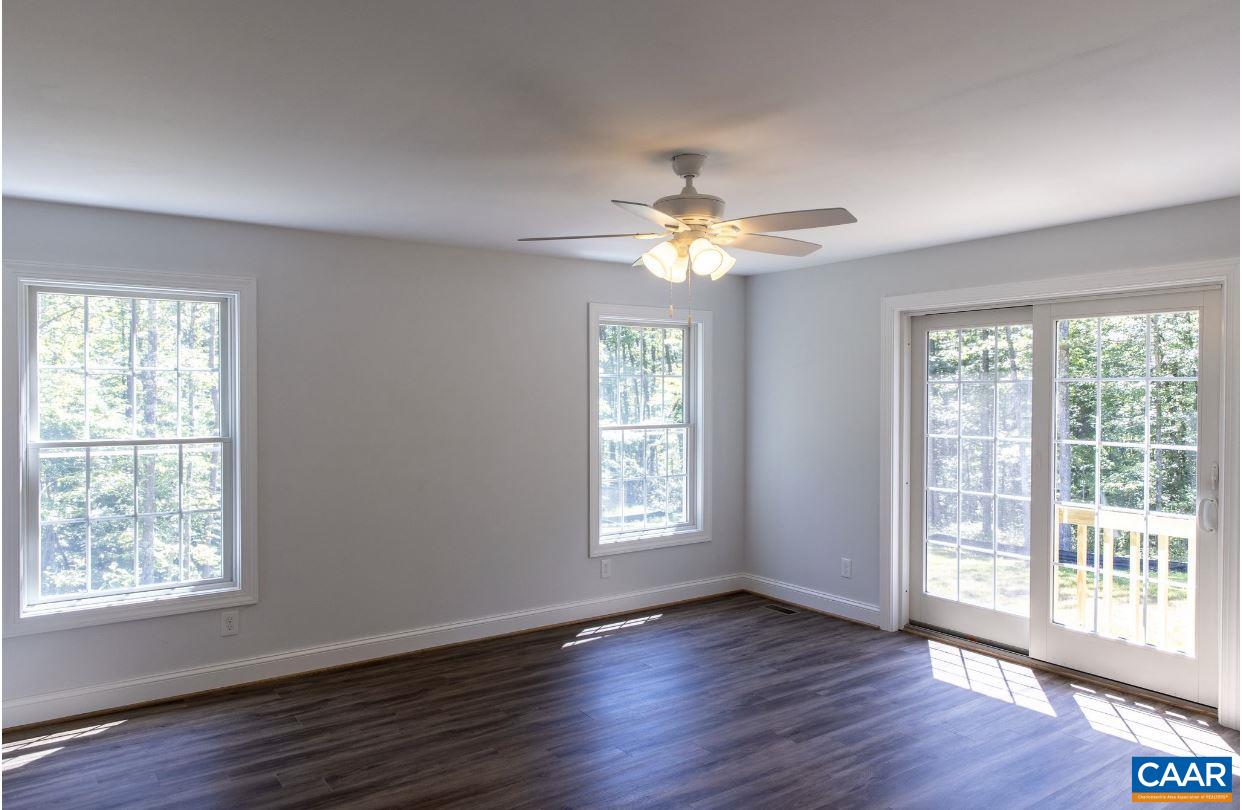 3564 Ridgeview Road Reva, VA 22735 - Photo 27 of 50 a view of an empty room with wooden floor and a window