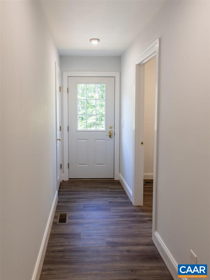 3564 Ridgeview Road Reva, VA 22735 - Photo 41 of 50 a view of a hallway with wooden floor and a window