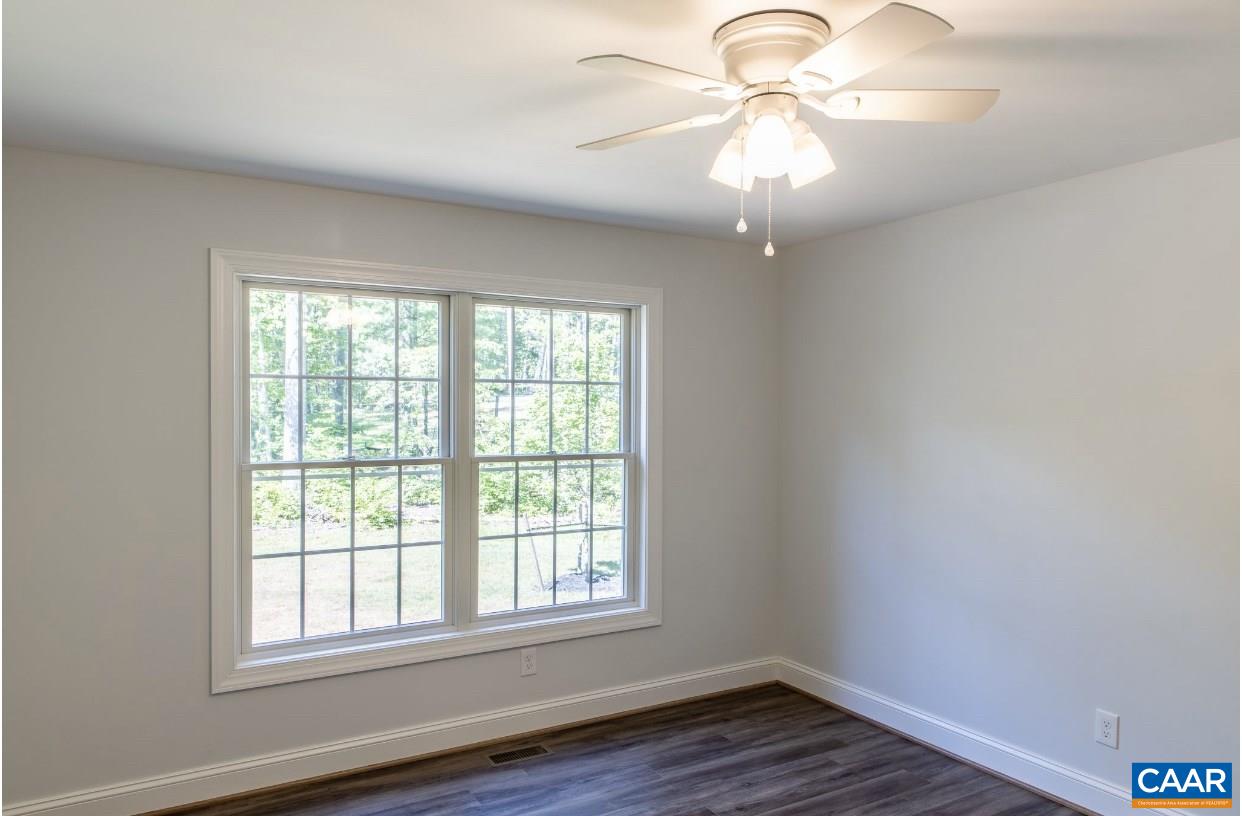 3564 Ridgeview Road Reva, VA 22735 - Photo 43 of 50 an empty room with a window and a chandelier fan