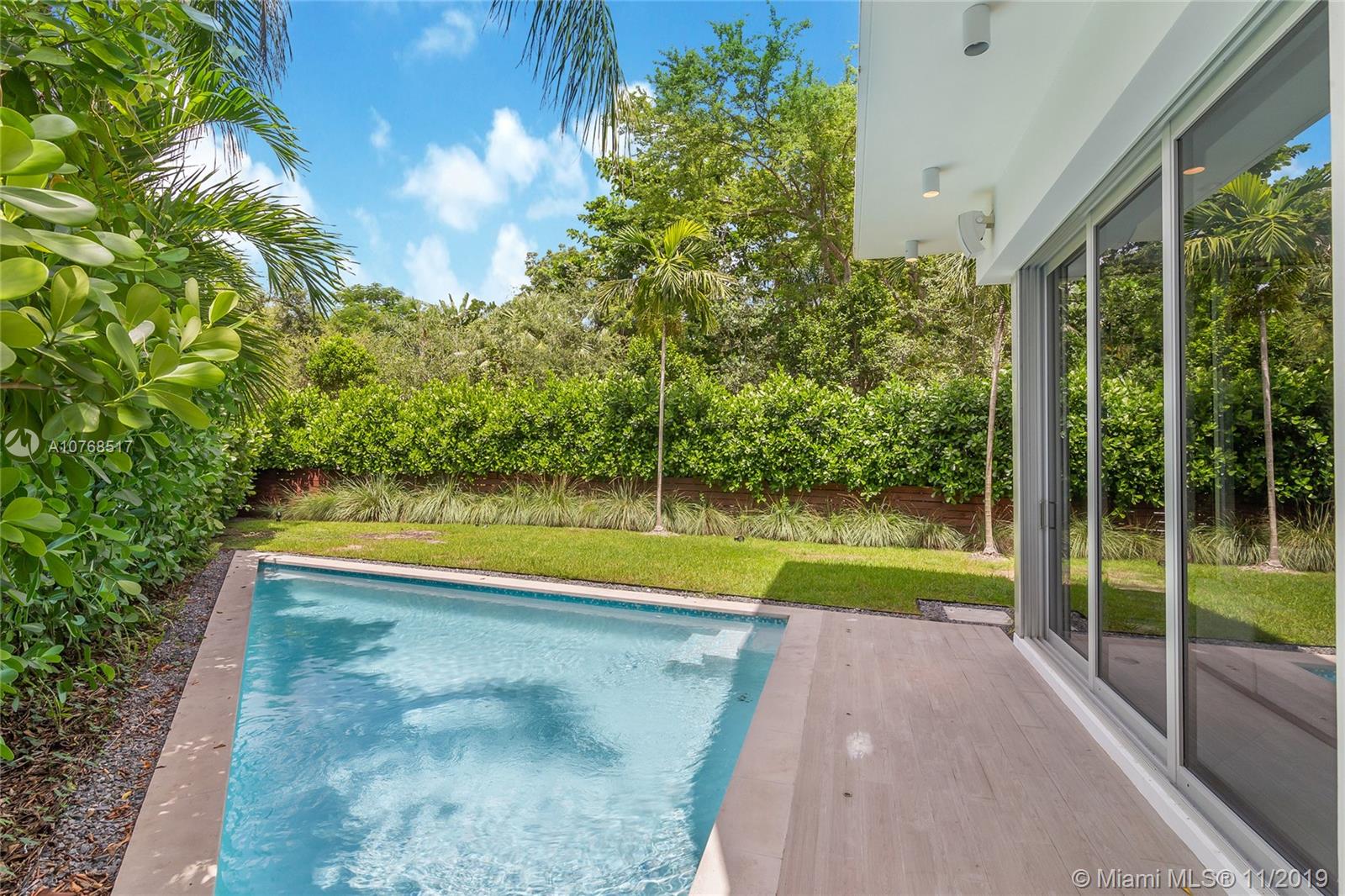 4080 Ensenada Avenue Miami, FL 33133 - Photo 15 of 20 a view of swimming pool from a yard
