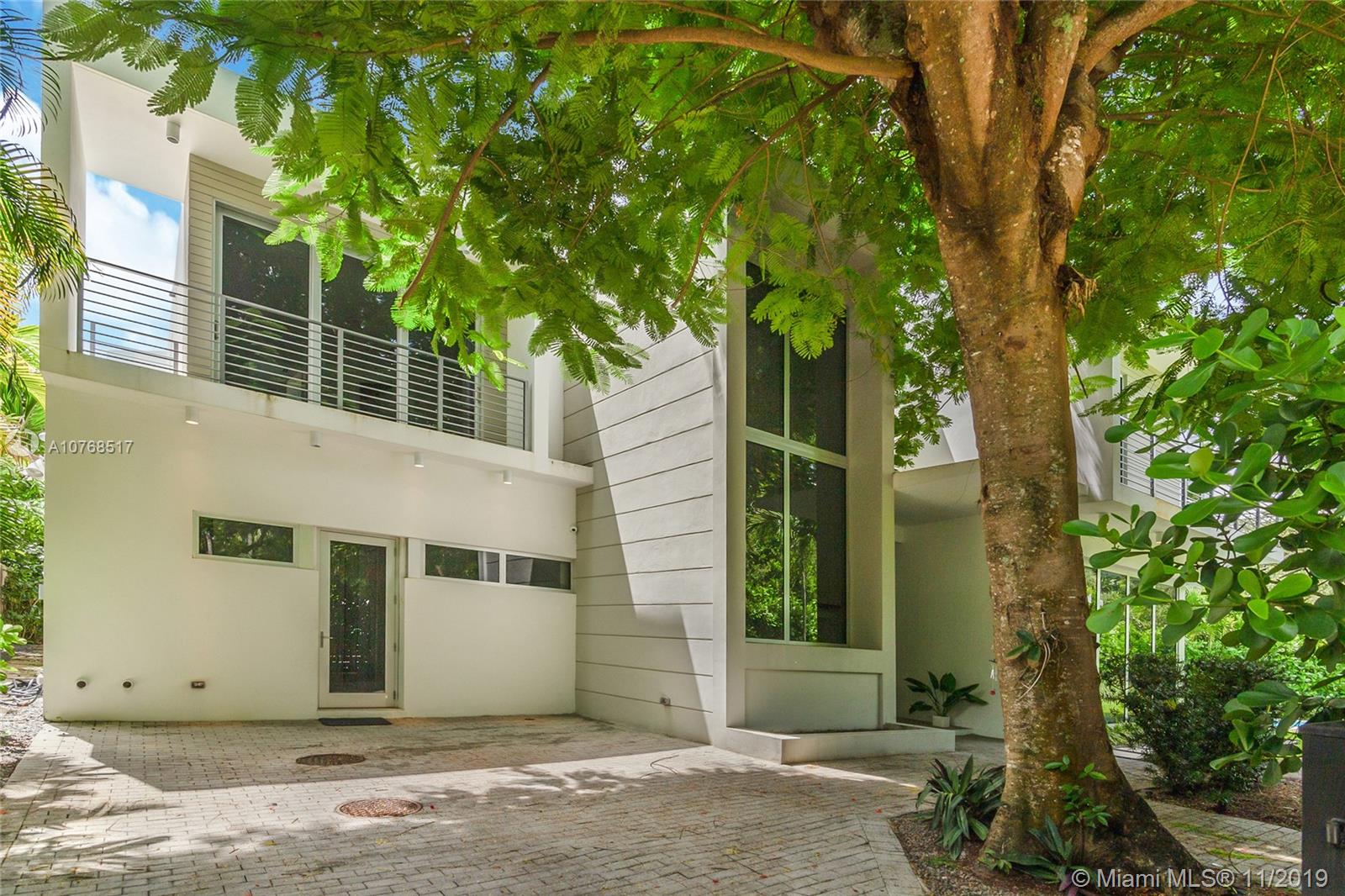 4080 Ensenada Avenue Miami, FL 33133 - Photo 18 of 20 a front view of a house