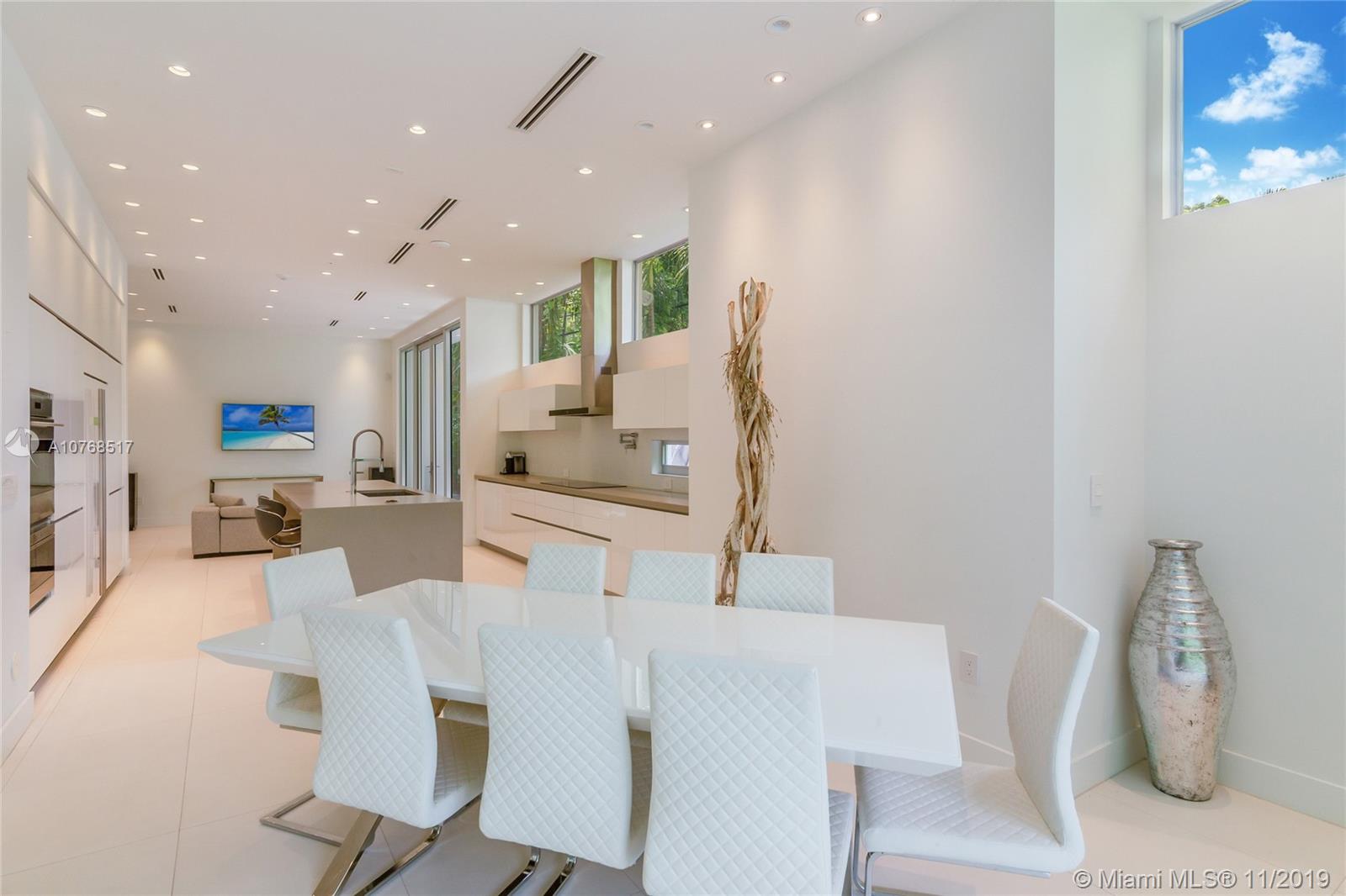 4080 Ensenada Avenue Miami, FL 33133 - Photo 19 of 20 a living room with furniture and a table